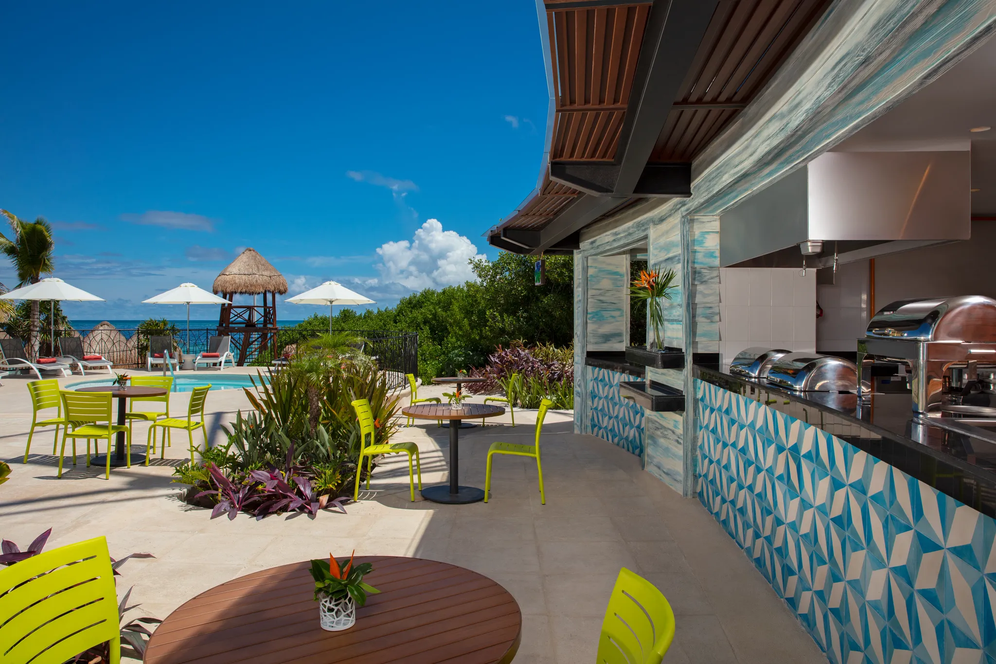 Barefoot Grill at Dreams Natura Resort & Spa serving casual grilled favorites poolside in a relaxed beach-casual setting.
