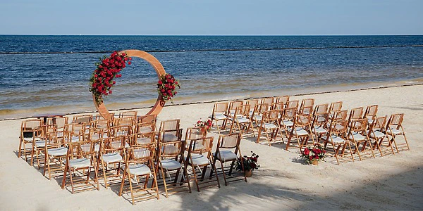 Beach wedding ceremony setup with oceanfront views at Dreams Natura Resort & Spa