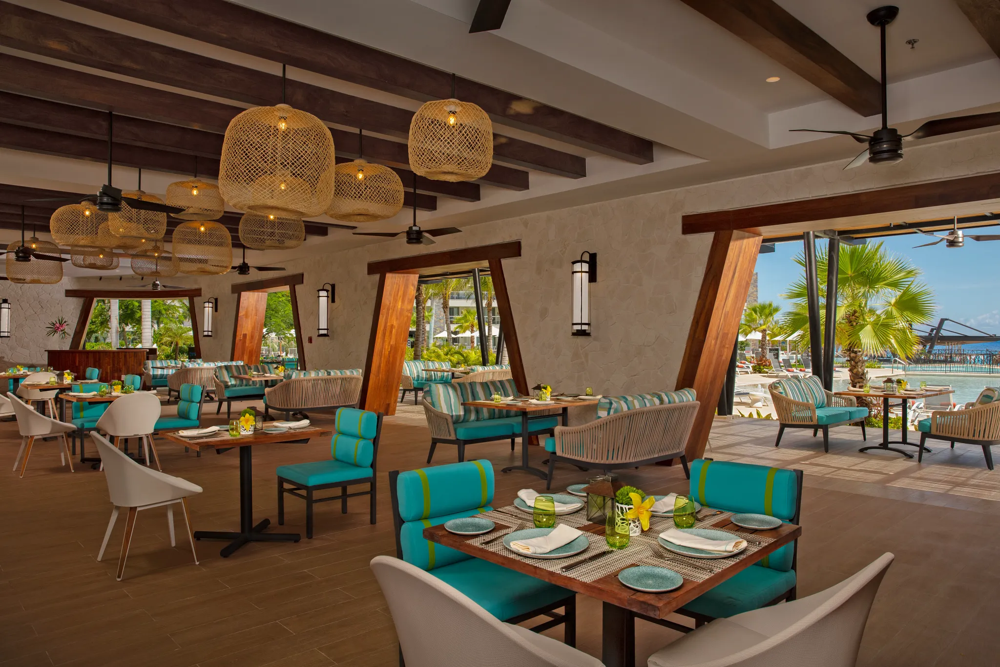 Bluewater Grill steakhouse at Dreams Natura Resort & Spa featuring elegant poolside dining, premium grilled steaks, and refined ambiance.
