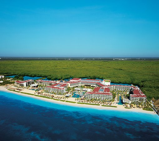 Breathless Riviera Cancun adults-only all-inclusive resort with beachfront pools, modern architecture, and vibrant nightlife atmosphere.