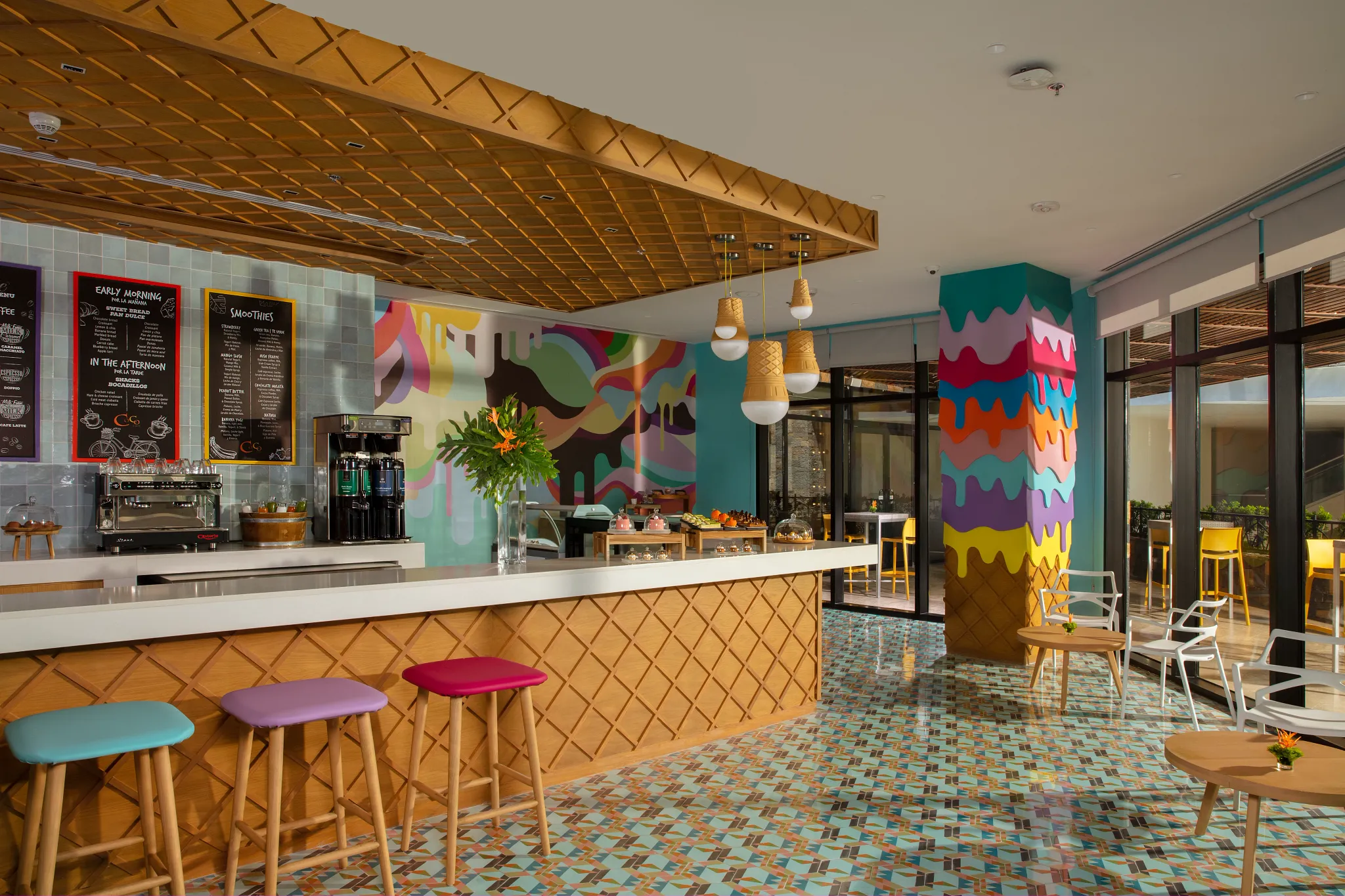 Coco Café at Dreams Natura Resort & Spa offering premium coffee, ice cream, and snacks in a cozy casual setting open 24 hours.