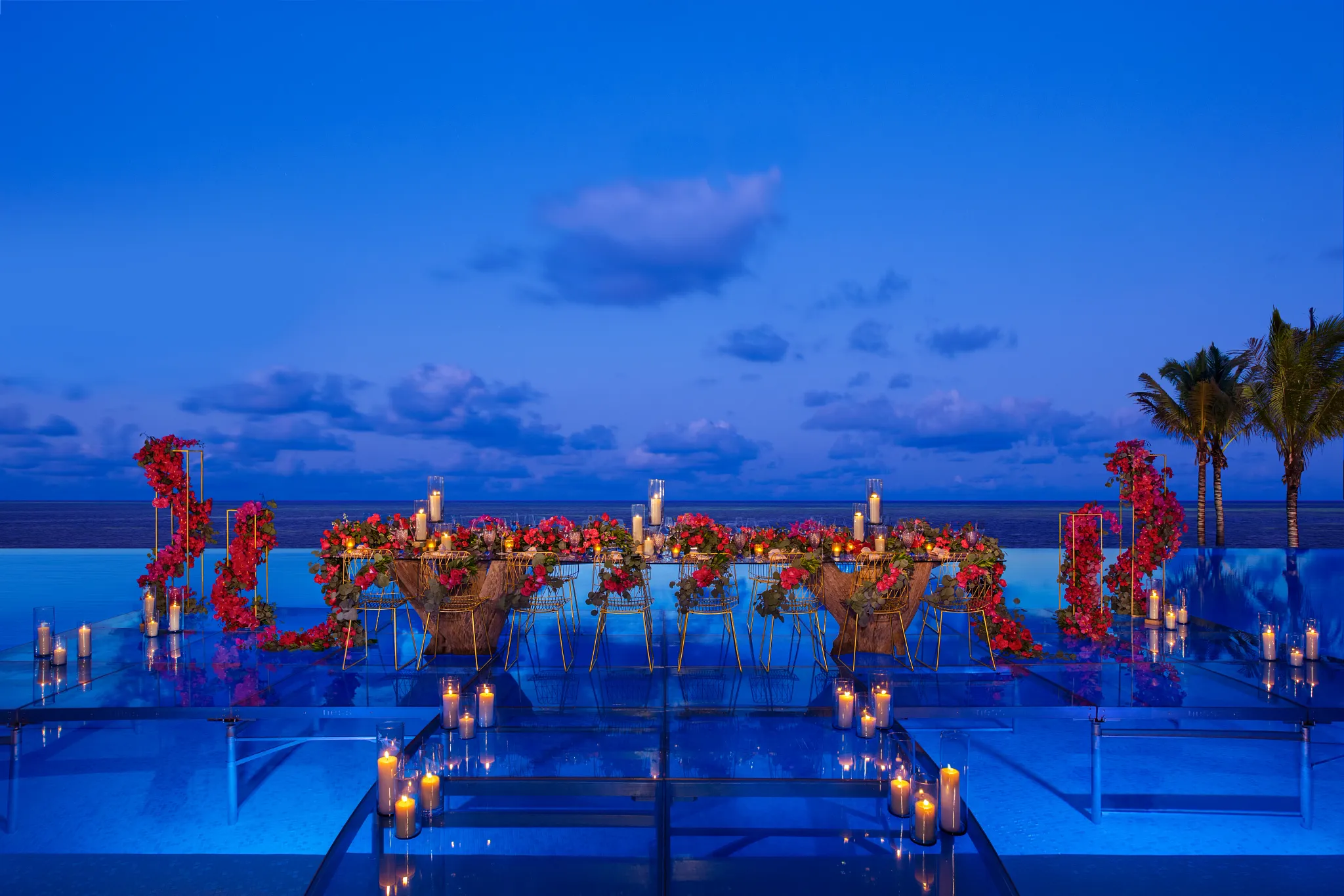 Oceanfront deck wedding setup with scenic tropical views at Dreams Natura Resort & Spa