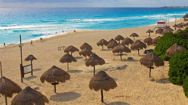 Delfines Beach near Dreams Natura Resort & Spa with wide sandy shoreline and panoramic Caribbean views