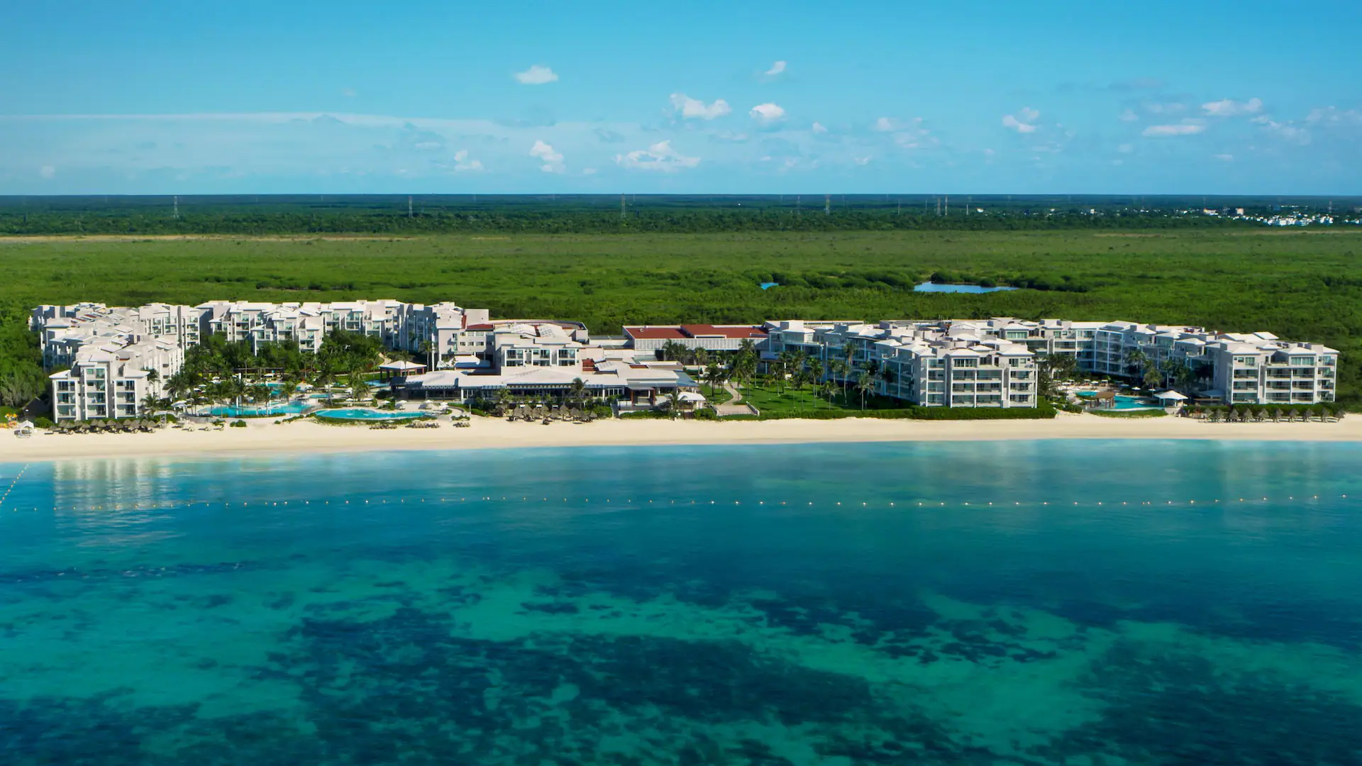 Dreams Jade Resort & Spa beachfront all-inclusive resort in Puerto Morelos with white sand beach, tropical pools, and ocean views.
