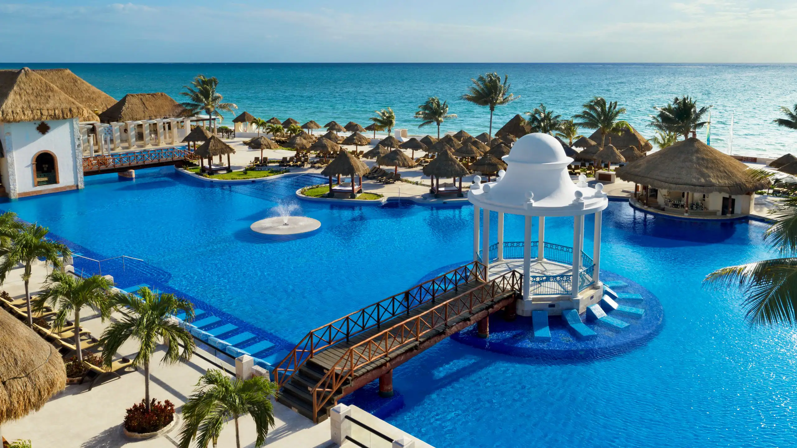 Dreams Sapphire Resort & Spa classic family all-inclusive resort in Puerto Morelos with white sand beach, tropical pools, and traditional resort grounds.