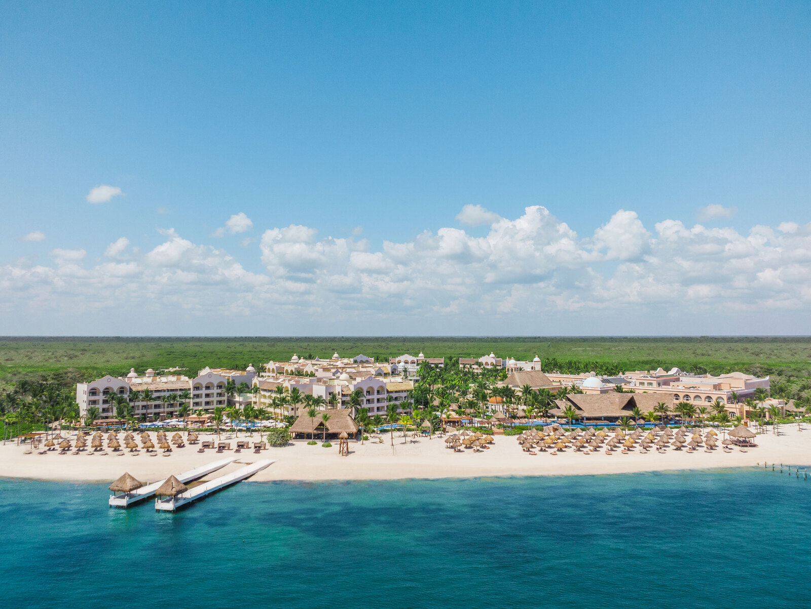 Excellence Riviera Cancun adults-only luxury all-inclusive resort with pristine beach, elegant pools, and romantic suites in Puerto Morelos.