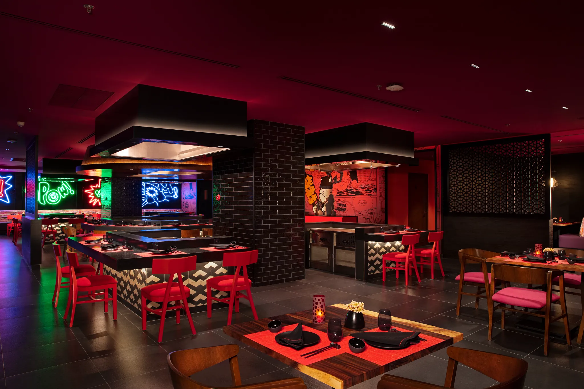 Himitsu Pan-Asian restaurant at Dreams Natura Resort & Spa featuring hibachi tables, teppanyaki cooking, and elegant Asian-inspired décor.