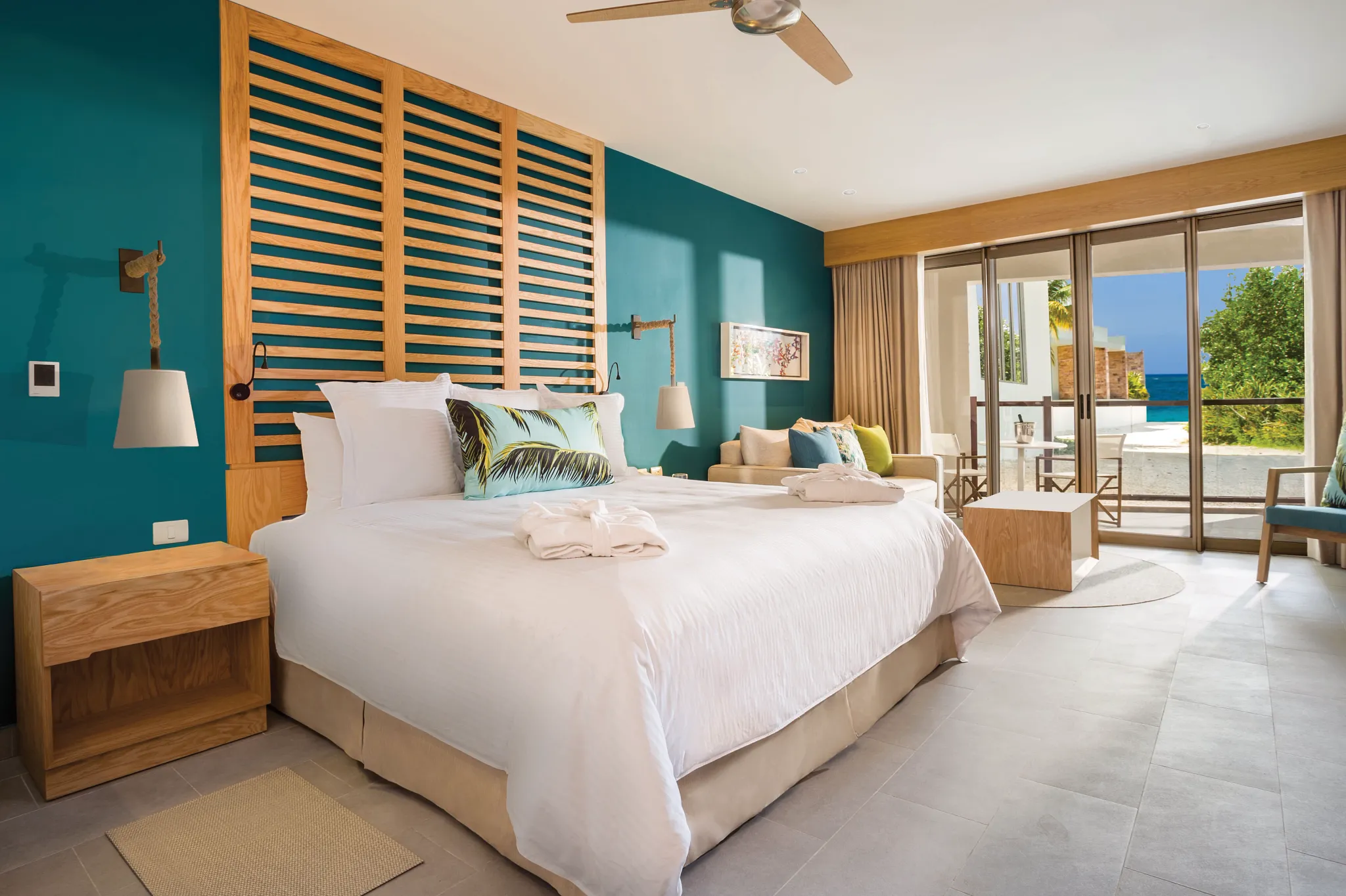 Junior Suite Partial Ocean View with king bed and balcony overlooking partial ocean view at Dreams Natura Resort & Spa.