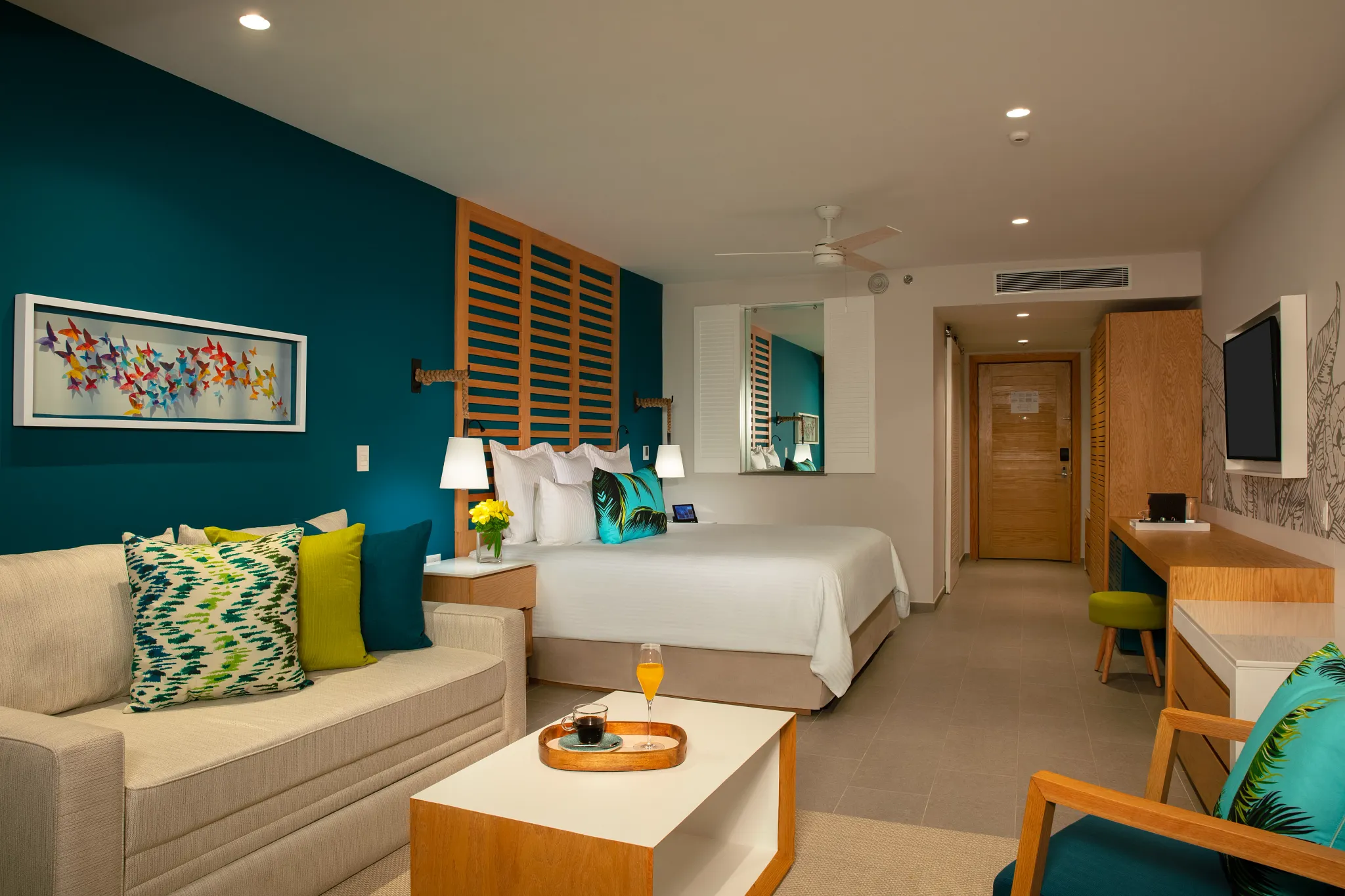 Junior Suite Swim Out with king bed and seating area at Dreams Natura Resort & Spa.