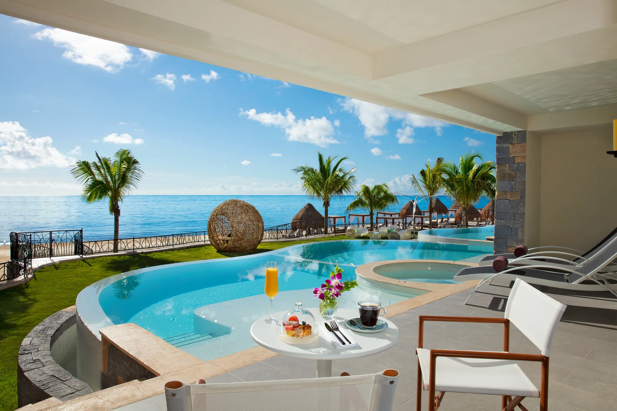 Preferred Club Governor Suite terrace with private plunge pool and partial ocean view at Dreams Natura Resort & Spa.