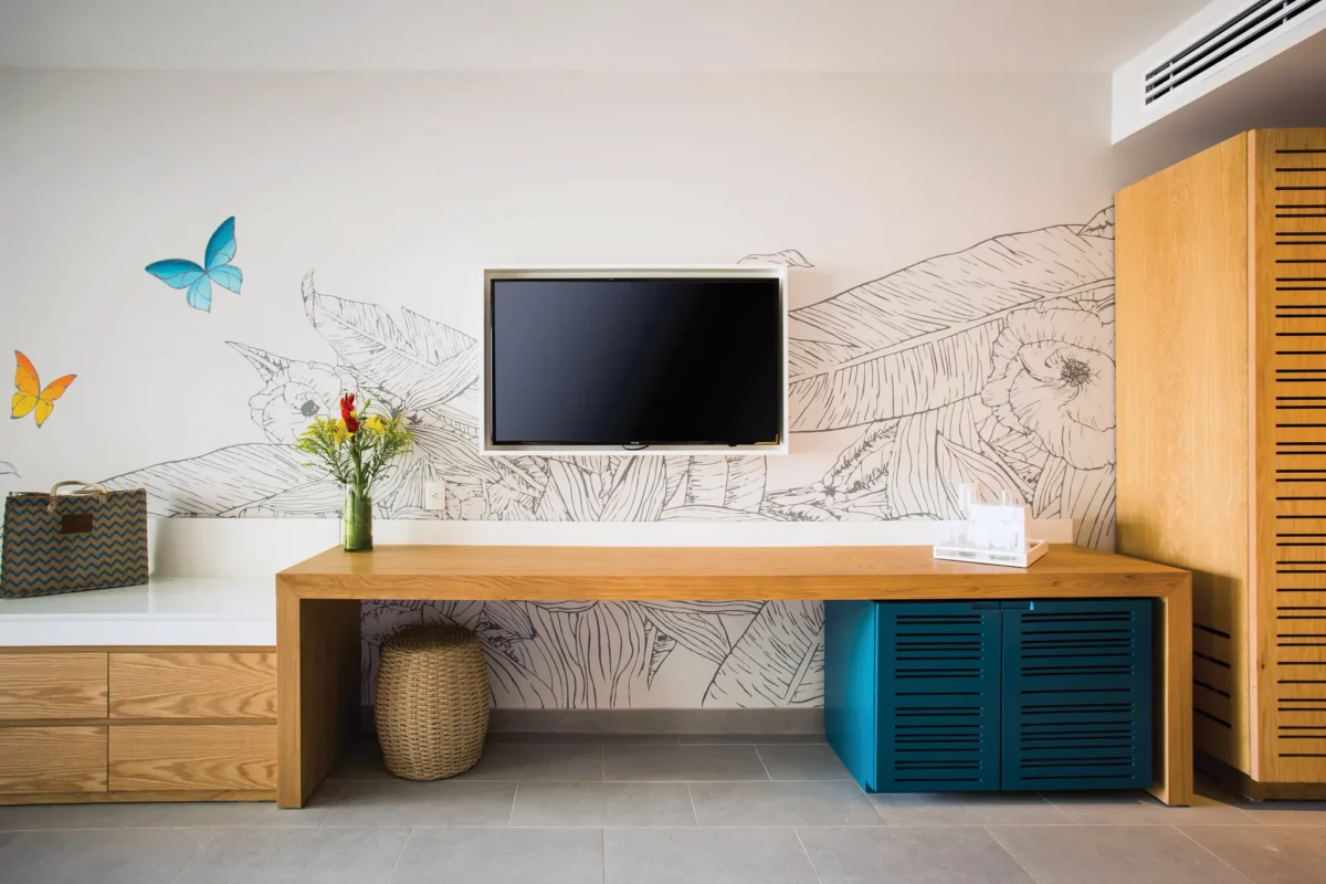 Preferred Club Junior Suite Ocean View workspace with TV and modern furnishings at Dreams Natura Resort & Spa.