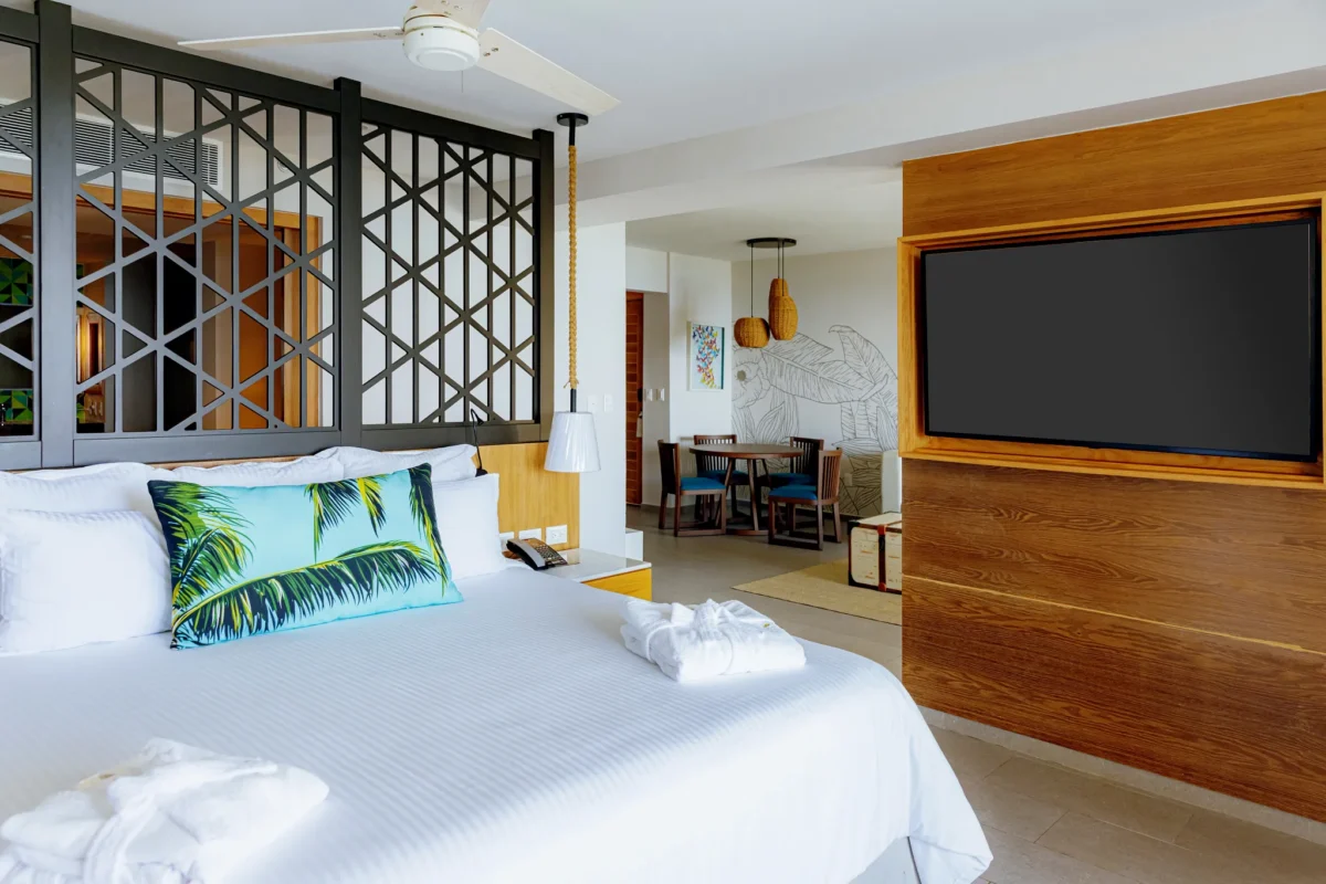 Preferred Club Master Suite Ocean Front king bedroom with modern décor at Dreams Natura Resort & Spa.