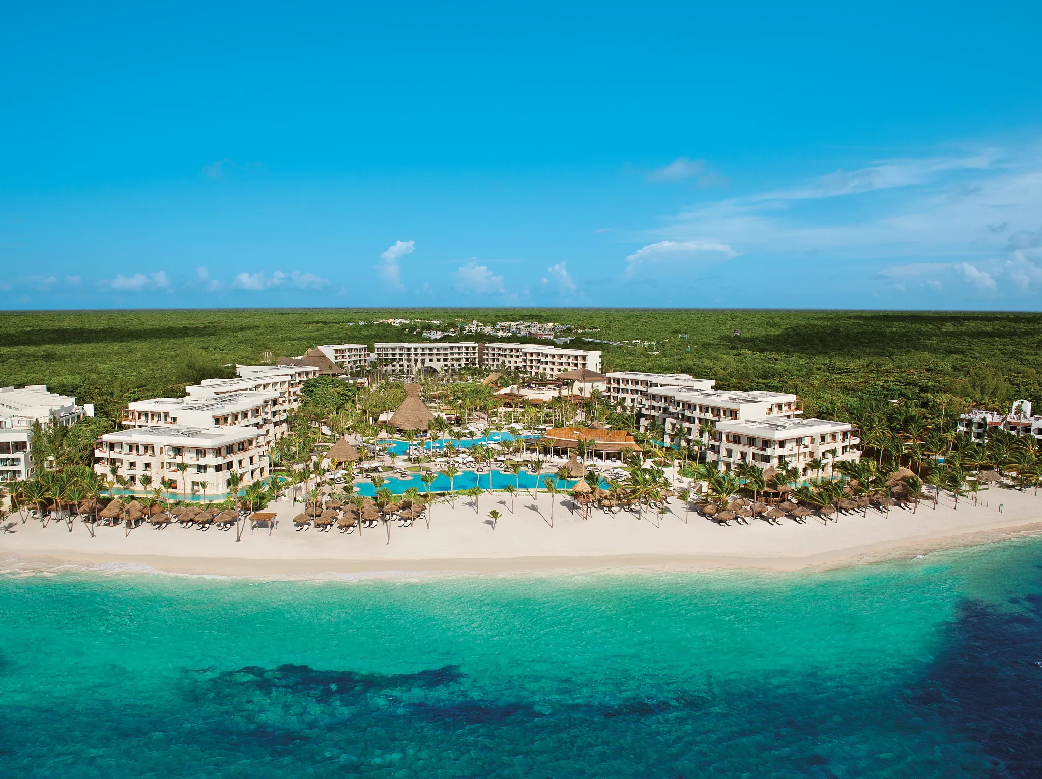 Secrets Akumal Riviera Maya adults-only luxury all-inclusive resort with pristine beach, elegant pools, and romantic atmosphere in Akumal, Mexico.