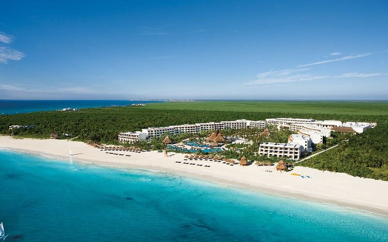 Secrets Maroma Beach Riviera Cancun adults-only luxury all-inclusive resort with pristine white sand beach and turquoise Caribbean waters.