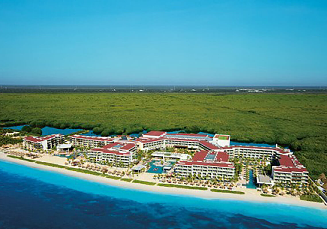 Secrets Riviera Cancun adults-only all-inclusive resort with oceanfront pools, elegant suites, and romantic beachfront setting in Puerto Morelos.
