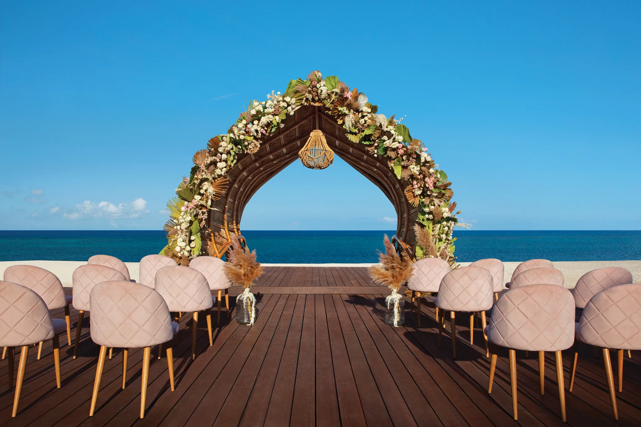 Wedding gazebo ceremony setup surrounded by tropical greenery at Dreams Natura Resort & Spa